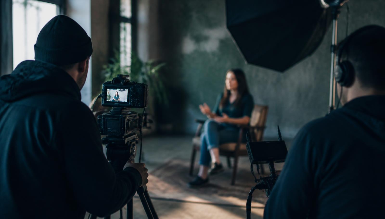 A small film crew shooting a donor story interview on location